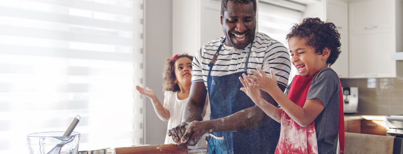 Father and children cooking together 